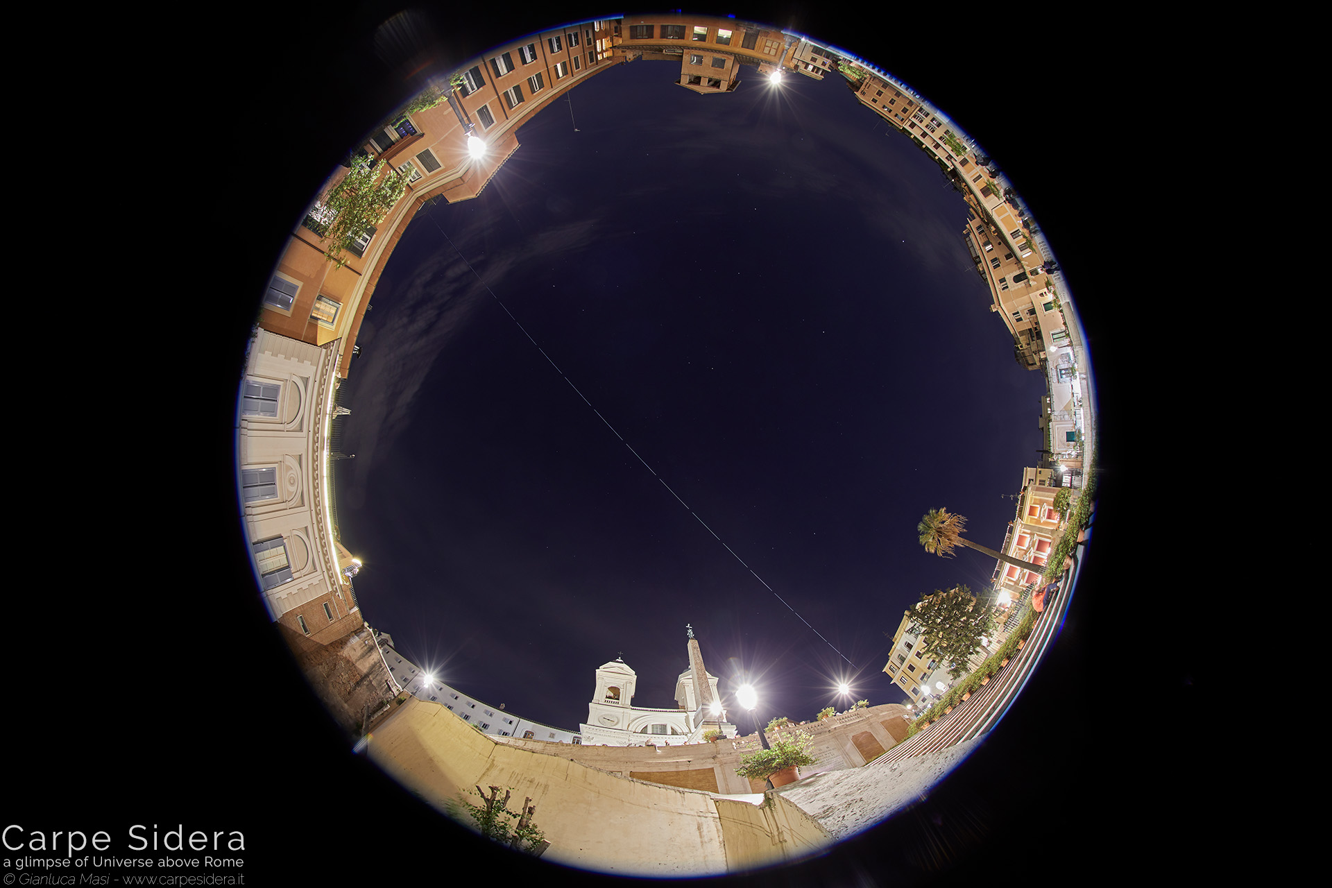 19. The International Space Station (ISS) flies above the Spanish Steps.